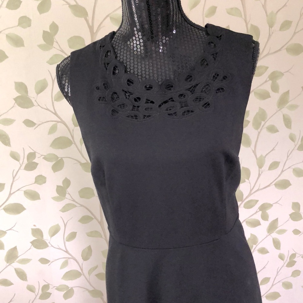 Talbots black sleeveless dress with black lace trim on the neck and hem. Size 12